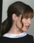 Jennifer Garner wearing her hair with bangs and partially styled up