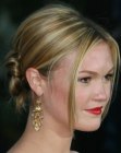Julia Stiles wearing an updo with the hair pinned underneath itself