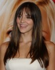 Katharine McPhee wearing her hair very long with angled sides and textured bangs