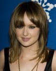 Kaylee Defer's long hair with bangs and angled styling