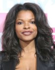 Keesha Sharp's long hairstyle with curls and rolling waves