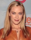 Kristanna Loken wearing her long hair in a simple off-centered style