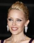 Kylie Minogue wearing her hair away from her face and pinned back