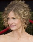 Kyra Sedgwick with her hair styled for a fake short hair look