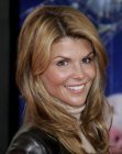 Lori Loughlin wearing her hair below the shoulders with layers that meet under the chin