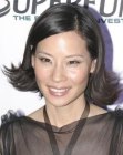 Lucy Lui with above the shoulders mid-length hair with ends that flip out