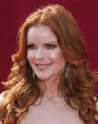 Marcia Cross sporting long red hair with waves and curls