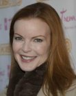 Marcia Cross sporting long red hair with parting on the side