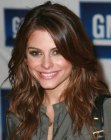 Maria Menounos with her hair cut in a long layered style with off-center parting