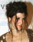 Marisa Tomei's feminine updo with loose hair strands