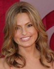 Mariska Hargitay's long and bouncy hair with side bangs