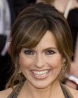 Mariska Hargitay's pinned up hair with loose tendrils