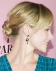 Marley Shelton's updo with her hair pulled tightly back into a knot