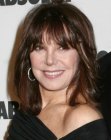 Marlo Thomas aged over 50 and wearing her brown hair long with bangs