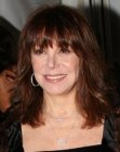 Marlo Thomas wearing long blunt cut hair with bangs and bounce