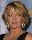 Melody Thomas Scott sporting a short haircut with layers