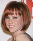 Natalya Rudakova sporting a chin-length bob hairstyle with bangs