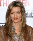 Natascha McElhone wearing her hair long and layered with a center part