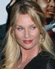 Nicollette Sheridan's easy hairstyle with the hair fastened in the back