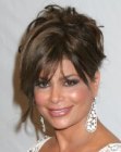 Paula Abdul's up-style with different strands of hair hanging out