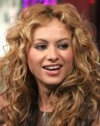 Paulina Rubio's gypsy hairstyle with long layers and curls