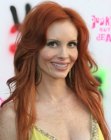 Phoebe Price with her very long red hair cut with layering