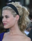 Rachael Taylor wearing her hair in a ponytail and with a hair band