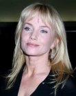 Rebecca de Mornay sporting a long hairstyle with just above the eyebrows bangs