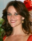 Brunette Reese Witherspoon wearing her hair long and curled