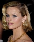 Reese Witherspoon wearing a neck length hairstyle with waves and curls
