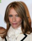 Rosanna Arquette wearing her brown hair long with layers and side bangs