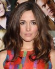 Rose Byrne with her big hair styled into lazy spiral curls