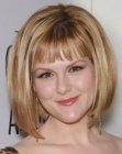 Sara Rue's bob hairstyle with short above the eyebrows bangs