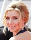 Sarah Chalke with her hair styled up and away from her face