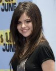 Selena Gomez sporting a long hairstyle with angled sides to frame the face