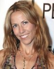 Sheryl Crow's long hairstyle with a light and practical appeal