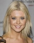 Tara Reid sporting a medium length layered haircut with razoring