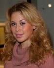 Tara Lipinski with her long hair styled away from her face
