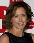 Tea Leoni's medium length hairstyle with curls