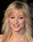 Teri Polo's long hairstyle with jagged ends and bangs