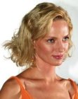 Uma Thurman with her hair in an almost shoulder length style with volume