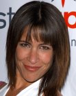 Vanessa Parise sporting a medium length layered shag with bangs