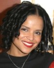Victoria Rowell's mid length hairstyle with a center part