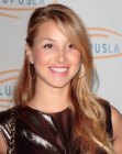 Whitney Port sporting long hair with layers and a high side part