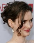 Winona Ryder's layered hair styled into a carefree upswirl