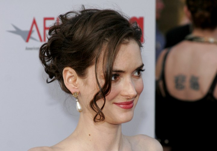Winona Ryder wearing her hair in an up swirl
