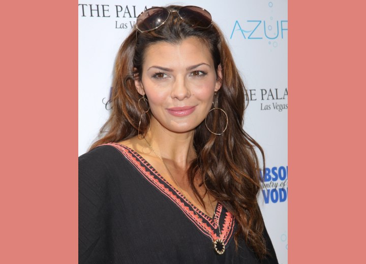 Ali Landry's long layered hair with cured ends