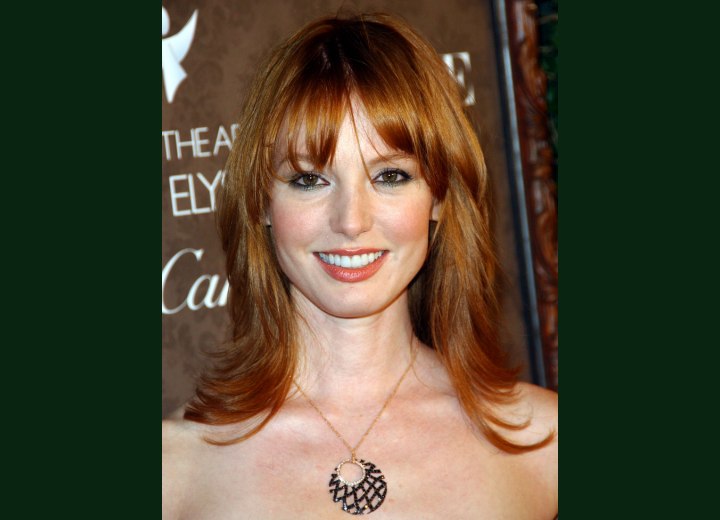 Alicia Witt's long reddish hair with layers