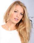 Blake Lively wearing long blonde hair with darker sections