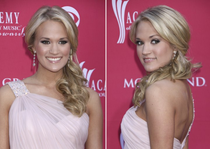 Carrie Underwood with her long hair brought over to one side
